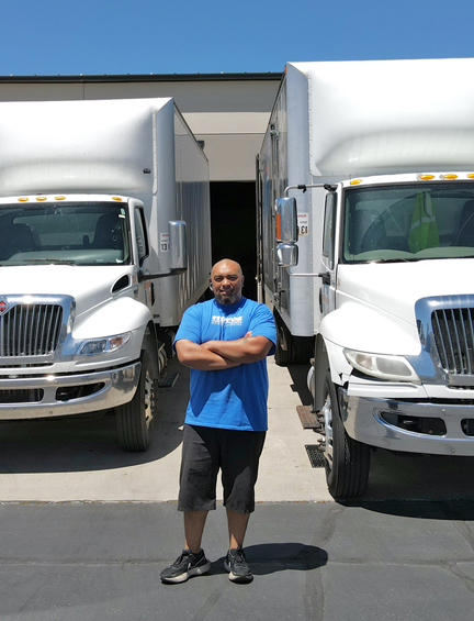 Meyer employee with Meyer trucks