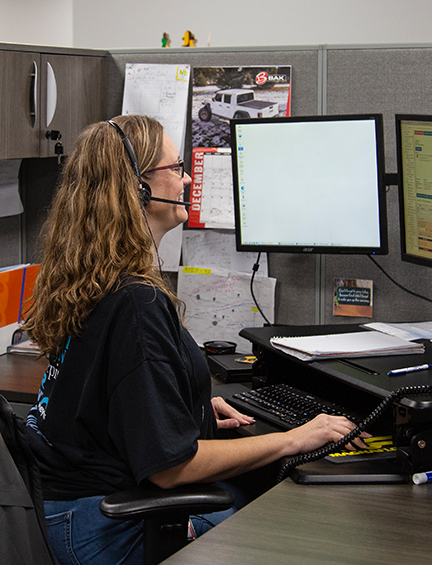 Route manager working on their computer