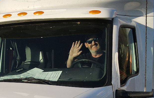 Meyer driver waving from a Meyer truck