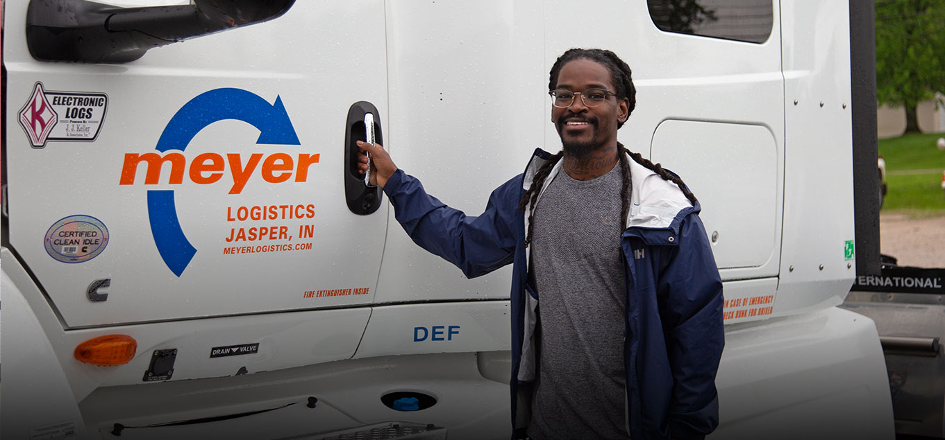 Meyer employee in front of a Meyer truck